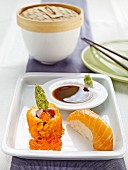 Nigiri sushi with salmon and maki with asparagus and caviar