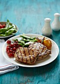 Pork steaks with roasted cherry tomatoes and green beans