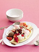 Neapolitan ice cream dessert with banana, strawberries and wafers