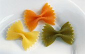 Three pieces of farfalle pasta on a plate