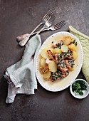 Potatoes with salmon and a parsley sauce