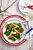 Rocket salad with grilled squid, chillies and lime