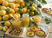 Lemon curd and lime curd in jars; tartlets with lemon curd and lime curd