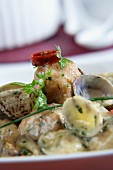 Monkfish fishballs with clams in green sauce