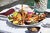 Fish and seafood platter on a table outdoors
