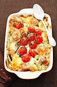 Potato bake with meatballs, tomatoes, beans and cheese