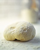 A ball of dough with flour (close-up)