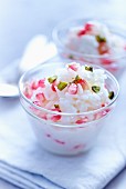 Rice pudding with pomegranate seeds and pistachios