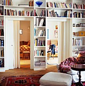Bookcases fitted around doors with view into adjacent rooms