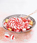 Plate with lollipops and peppermint hard candies