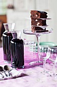 Close up of cake and wine carafes on table