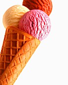 An ice cream cone with three scoops of ice cream (strawberry, vanilla, chocolate)