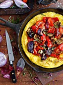 Polenta pizza with peppers and onions
