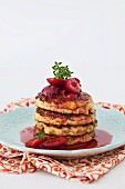 Millet fritters with spiced red wine plum sauce