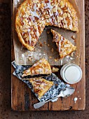 Puff pastry pie filled with chocolate, flaked almonds and glacé icing
