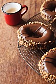 Doughnuts with chocolate glaze and chopped nuts