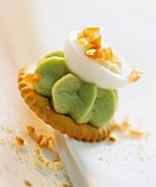 Cracker topped with avocado mousse and egg