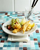 Deep-fried fillets of fish with salad leaves