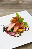 Veal steak and crispy fried breast of veal with morels, carrots and watercress