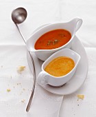 Tomato sauce and creamy paprika sauce in sauce boats