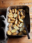 Oven-roasted early potatoes in the roasting tin