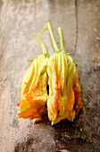 Courgette flowers on an old chopping board