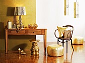 Lamps, cushions, shoes and miniature table - home accessories in shimmering gold