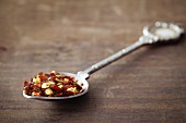 Dried chilli flakes on a spoon