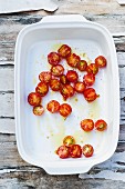 Halved cherry tomatoes in a casserole dish