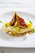 A quenelle of yoghurt with figs and mango