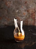 Vinaigrette in a glass with a spoon