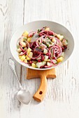Herring and potato salad with onions and kidney beans