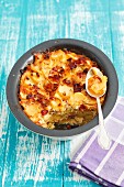 Potato gratin with bacon, onions and egg