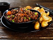 Minced beef with peas, carrots and roast potatoes
