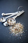 Measuring Spoons with a Mixture of Seasonings and Salt