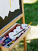 Paint cups on easel