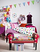 Colourful child's bedroom with bed, shelves and stool