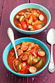 Sausage stew with peppers, tomatoes and courgette