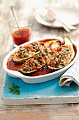 Courgettes stuffed with minced meat and rice, in tomato sauce