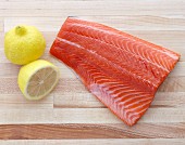 A Raw Filet of Salmon with Lemon