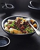 Pasta dish with meat and peas