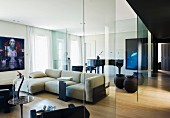 Designer apartment with glass partitions, artworks and concert grand piano in background