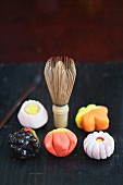 Various wagashi (Japanese sweets) and a tea whisk