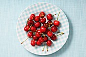 Fresh cherries on a checked plate