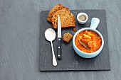 Vegetable stew with lentils and tomatoes, in cups with soda bread