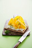 Mango and cream cheese on a cracker