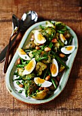 Roast potatoes with green beans and boiled eggs