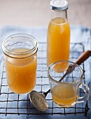 Homemade chicken stock in glass containers