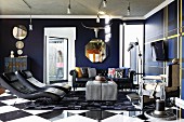 Dark blue and black seating area with leather loungers in front of flat screen TV, Chesterfield sofa and antique barber's chair