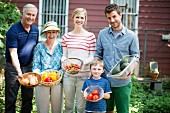Three generation family with homegrown vegetables